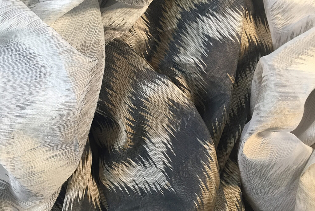 Charcoal and gold ikat sheer hospitality fabric